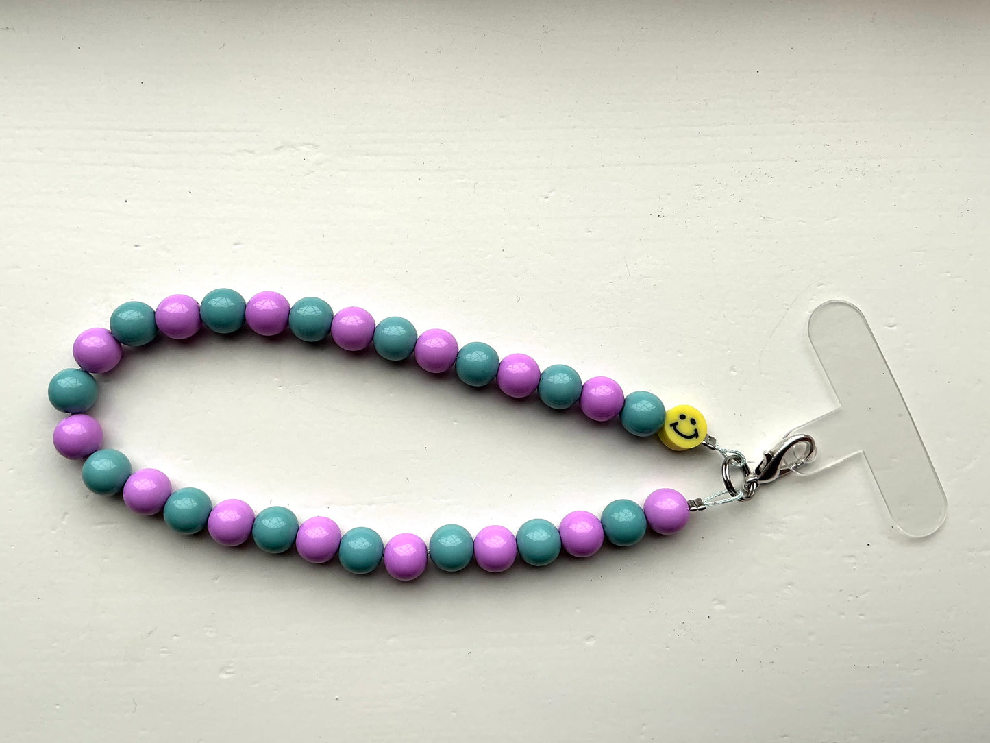 Gekleurde kralen telefoonkoord zeegroen/lila