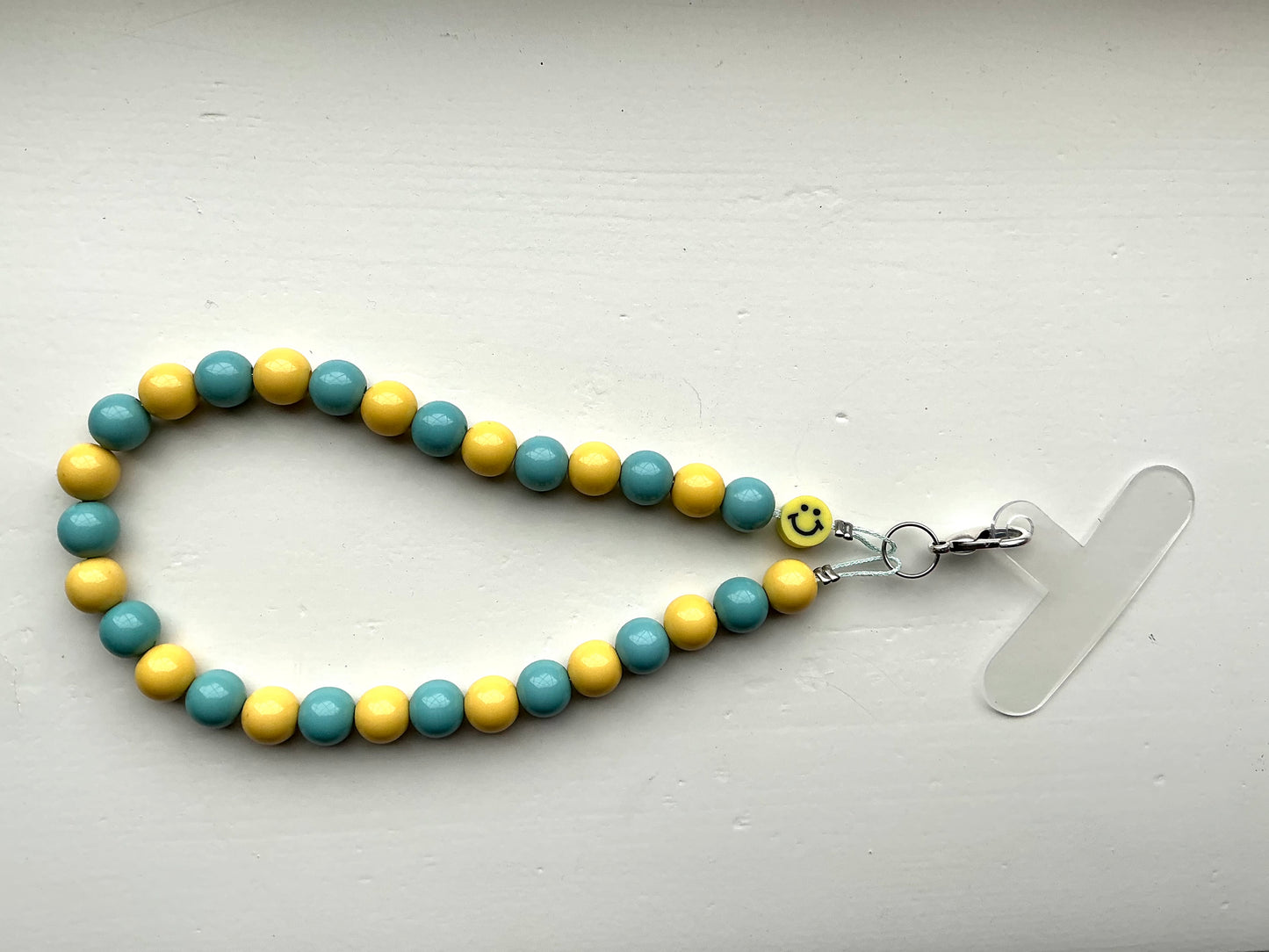 Gekleurde kralen telefoonkoord zeegroen/geel